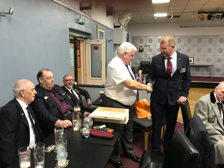 Joe Davidson presenting Gil Nicol with a bottle of Rum adorned with Para Wings and Pegasus at the RBS Grangemouth on 22 September 2019