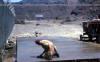 Finishing off a concrete raft. Aden 1966.